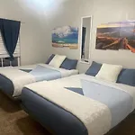 Relax By The Beach- 2 Queen Beds,Couch, Tv In Bedroom, Tv In Living Room, Outdoor Patio, Free Parking, Free Wifi, Free Coffeebar, Full Size Pool ,Hottub, Kid Pool, Gym , Elevator, Near Restaurants, Neargrocery Stores